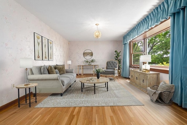 24 Flume Rd, Gloucester, MA 01930 - living room featuring wallpapered walls, wood finished floors, a chandelier, and baseboards