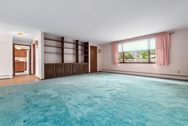 24 Flume Rd, Gloucester, MA 01930 - unfurnished living room featuring a baseboard heating unit and light colored carpet