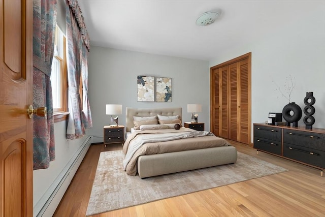 24 Flume Rd, Gloucester, MA 01930 - bedroom featuring a baseboard radiator, a closet, and wood finished floors