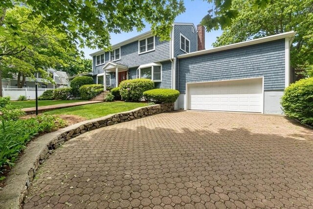 24 Flume Rd, Gloucester, MA 01930 - view of front of house featuring a chimney and an attached garage