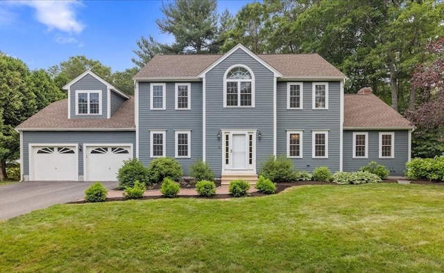 41 Nancy Dr, Ashland, MA 01721 - colonial inspired home with driveway, a shingled roof, a front yard, and a garage