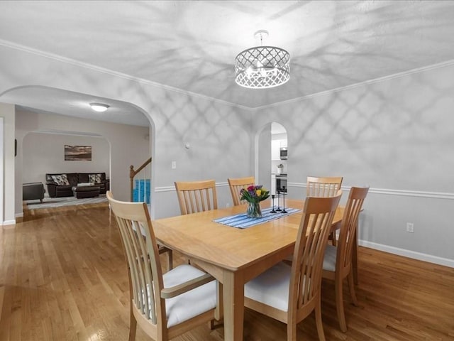41 Nancy Dr, Ashland, MA 01721 - dining room featuring arched walkways and wood finished floors