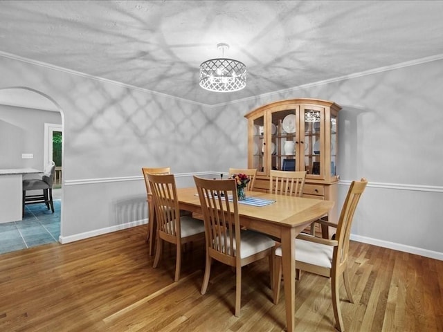 41 Nancy Dr, Ashland, MA 01721 - dining room with arched walkways, wood finished floors, and ornamental molding