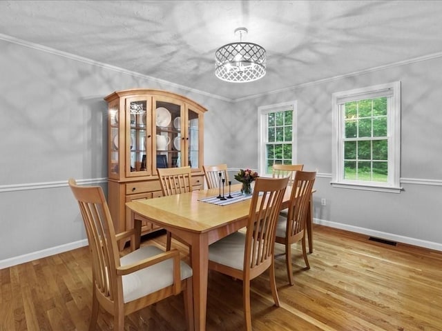 41 Nancy Dr, Ashland, MA 01721 - dining space with wood finished floors and crown molding