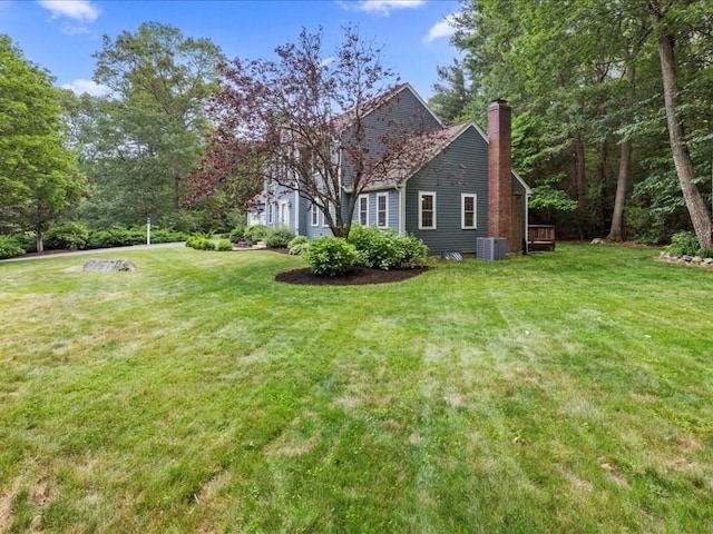 41 Nancy Dr, Ashland, MA 01721 - view of side of property with a chimney and a lawn