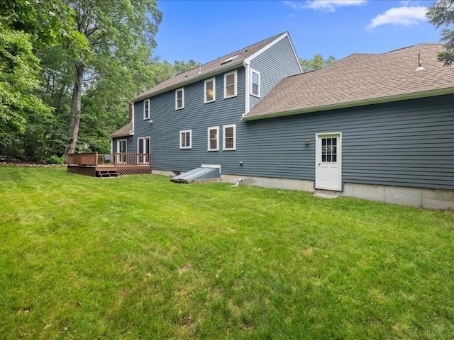 41 Nancy Dr, Ashland, MA 01721 - rear view of house with a wooden deck, a lawn, and roof with shingles