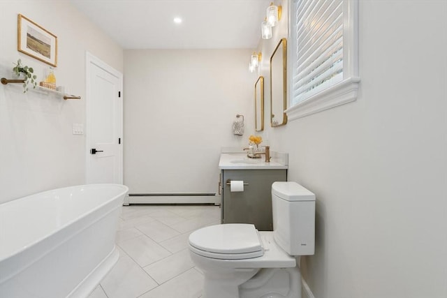 bathroom featuring vanity, a baseboard radiator, a soaking tub, tile patterned flooring, and toilet