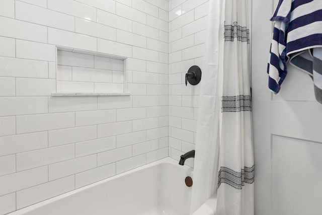 bathroom featuring shower / bathtub combination with curtain