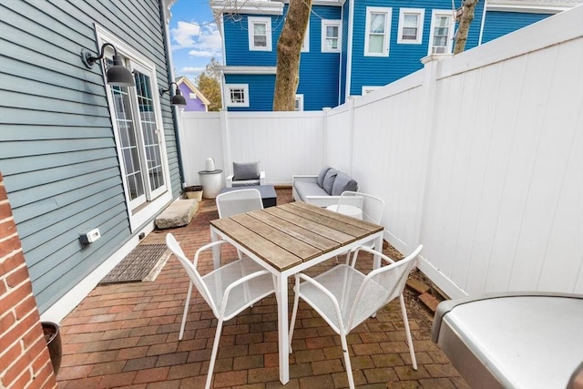 view of patio / terrace featuring outdoor dining area and a fenced backyard