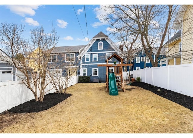 view of play area with a yard and a fenced backyard