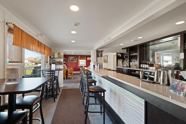 bar featuring dark tile flooring and a wealth of natural light