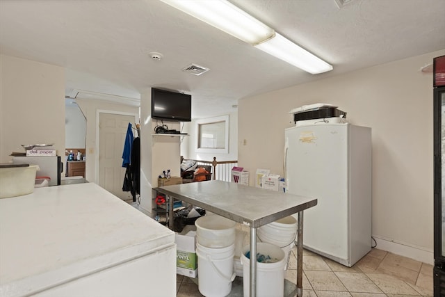 kitchen with light tile floors