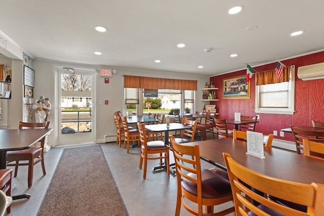 dining room with crown molding, an AC wall unit, and a wealth of natural light