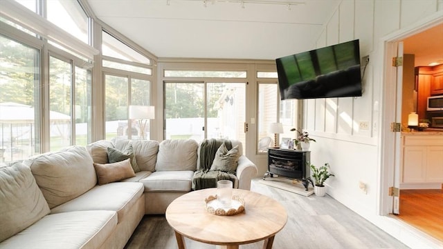 90 Braley Rd, Freetown, MA 02717 - sunroom with a wood stove and wood finished floors