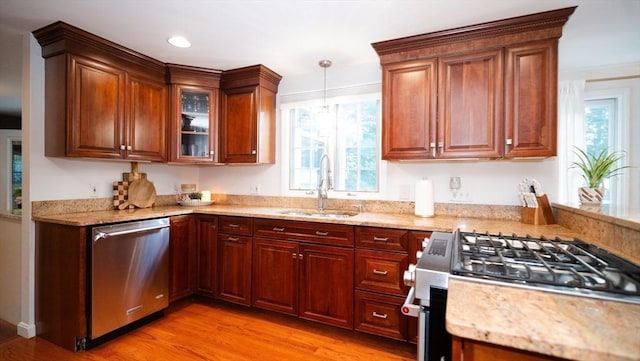 90 Braley Rd, Freetown, MA 02717 - kitchen with stainless steel appliances, light stone countertops, light wood-style floors, and decorative light fixtures