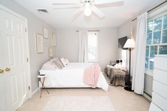 90 Braley Rd, Freetown, MA 02717 - carpeted bedroom featuring a ceiling fan and a baseboard heating unit