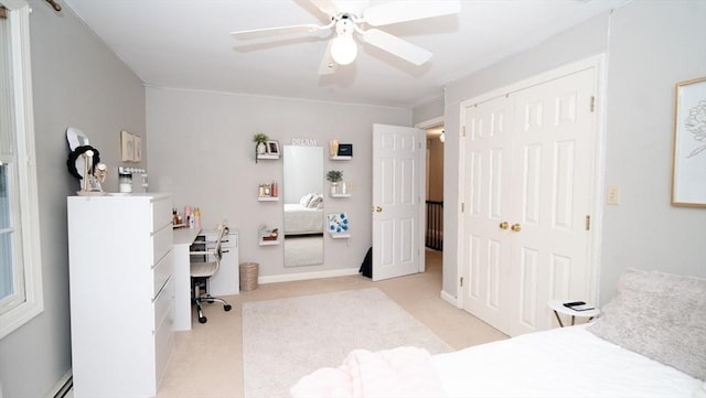 90 Braley Rd, Freetown, MA 02717 - bedroom featuring an office area, a closet, light colored carpet, a baseboard heating unit, and ceiling fan