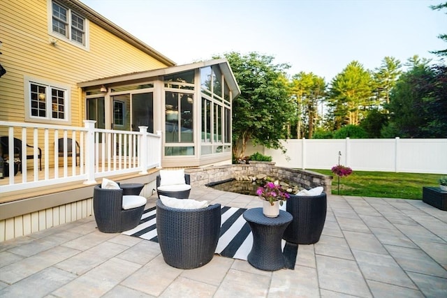 90 Braley Rd, Freetown, MA 02717 - fenced backyard featuring a sunroom and a patio area