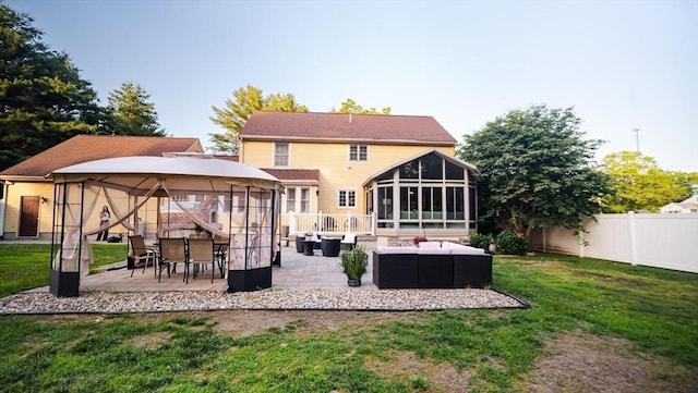 90 Braley Rd, Freetown, MA 02717 - rear view of house with an outdoor hangout area, a sunroom, a gazebo, and a patio area