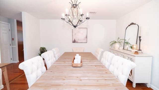 90 Braley Rd, Freetown, MA 02717 - dining space featuring a chandelier and wood finished floors