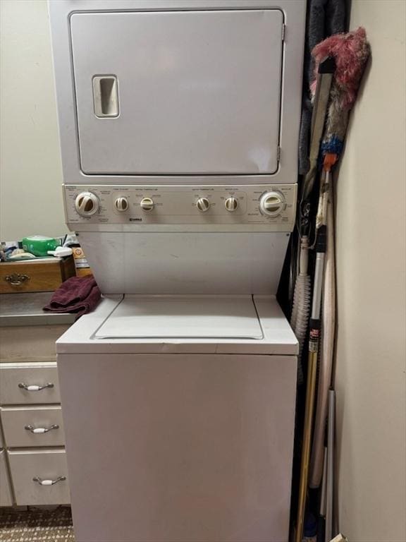 laundry room featuring stacked washer / dryer