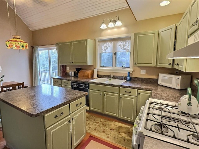 kitchen featuring sink, decorative light fixtures, white appliances, and green cabinetry