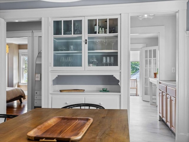 dining area featuring light wood-style floors and healthy amount of natural light