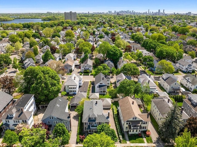 aerial perspective of suburban area featuring a view of skyline and a large body of water