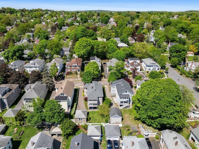 aerial view of property and surrounding area with nearby suburban area