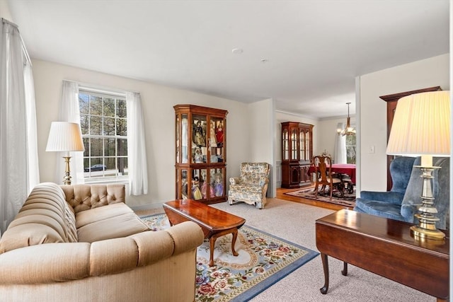 1 Cottonwood Cir, Kingston, NH 03848 - carpeted living room featuring a chandelier