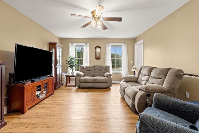 1 Cottonwood Cir, Kingston, NH 03848 - living room with light wood-style floors and a ceiling fan