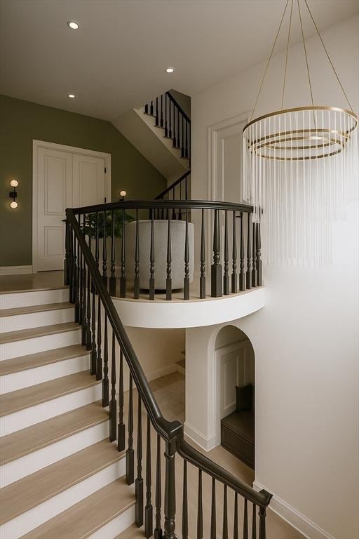 39 Rogers Ave, Somerville, MA 02144 - stairs featuring a chandelier and recessed lighting