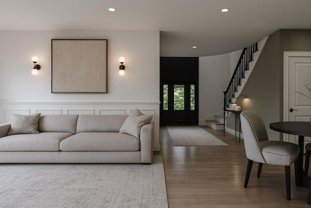 39 Rogers Ave, Somerville, MA 02144 - living room featuring stairway, wood finished floors, recessed lighting, and wainscoting