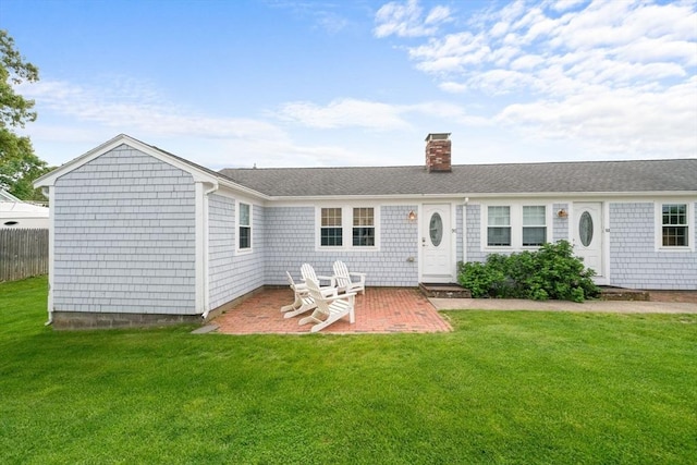 90 Broadway St Unit 90, Yarmouth, MA 02673 - back of house with a chimney, a patio, and roof with shingles