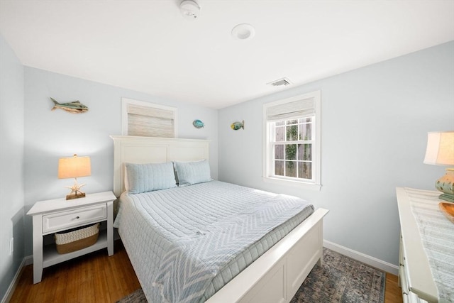 90 Broadway St Unit 90, Yarmouth, MA 02673 - bedroom featuring baseboards and dark wood-style flooring