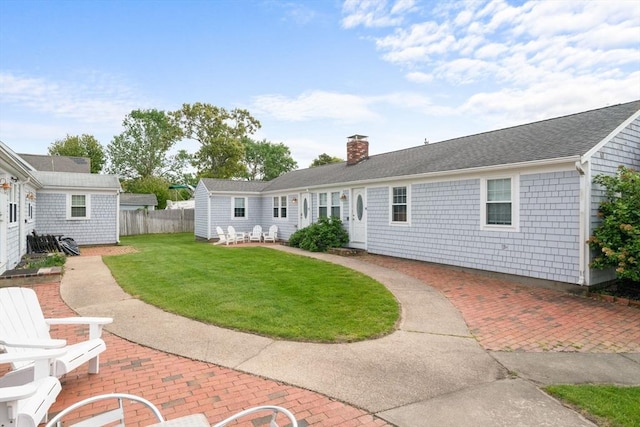 90 Broadway St Unit 90, Yarmouth, MA 02673 - rear view of house featuring a patio and a chimney