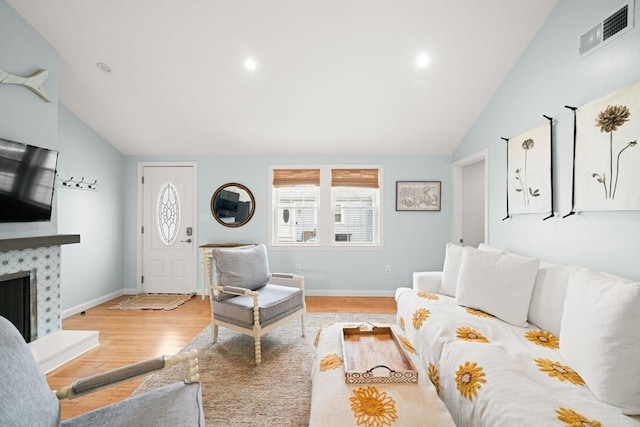 90 Broadway St Unit 90, Yarmouth, MA 02673 - living area with vaulted ceiling, wood finished floors, a fireplace, baseboards, and recessed lighting