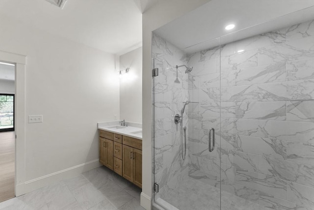 134 Court St Unit 2, Plymouth, MA 02360 - full bath with baseboards, double vanity, a marble finish shower, marble finish floor, and a sink