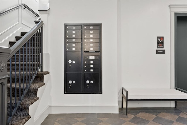 134 Court St Unit 2, Plymouth, MA 02360 - stairway featuring mail area and baseboards