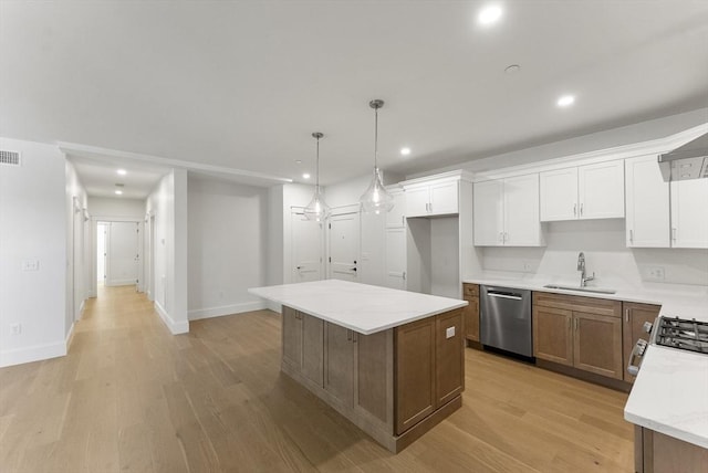 134 Court St Unit 2, Plymouth, MA 02360 - kitchen featuring white cabinetry, visible vents, a sink, stainless steel appliances, and light wood finished floors