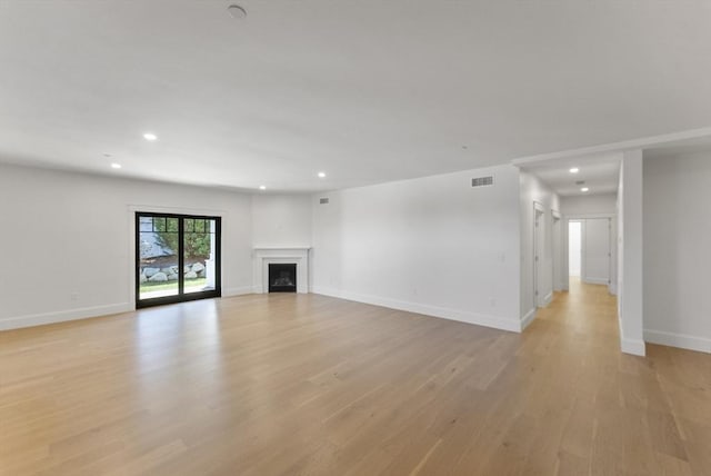 134 Court St Unit 2, Plymouth, MA 02360 - unfurnished living room with visible vents, baseboards, recessed lighting, and light wood-style floors
