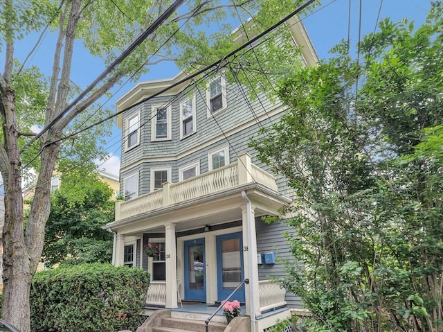 36-38 Rice St Unit 3, Cambridge, MA 02140 - view of front of home with a balcony and covered porch