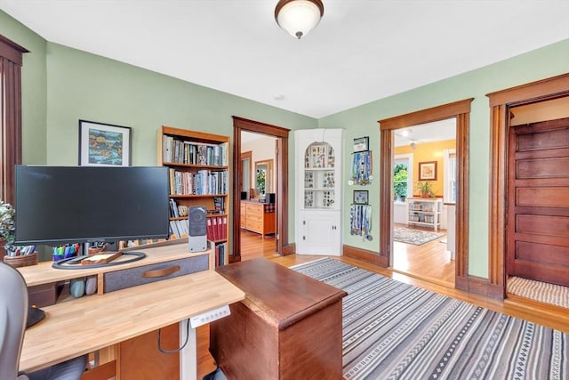 36-38 Rice St Unit 3, Cambridge, MA 02140 - home office featuring wood finished floors and baseboards