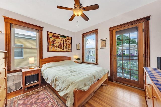 36-38 Rice St Unit 3, Cambridge, MA 02140 - bedroom featuring access to outside, light wood-style floors, and a ceiling fan