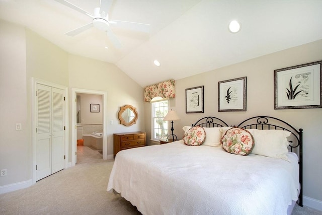 bedroom featuring recessed lighting, lofted ceiling, carpet floors, and ensuite bath