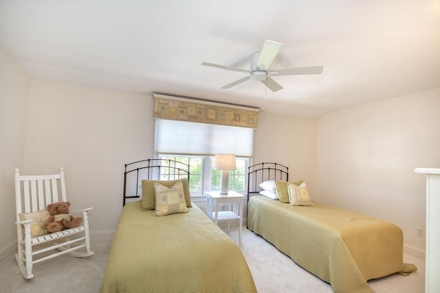 carpeted bedroom with baseboards and ceiling fan