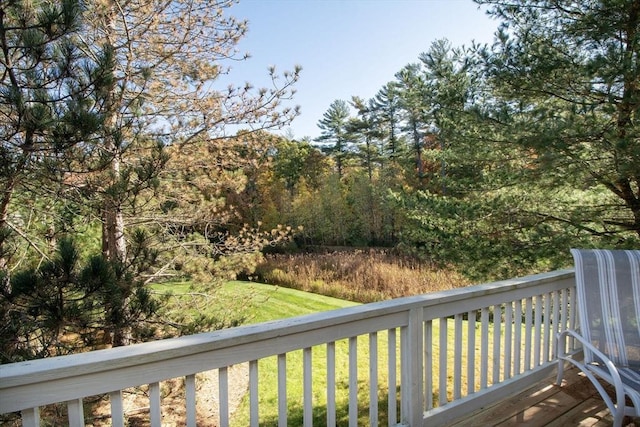 wooden terrace with a yard