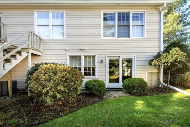 rear view of property with a yard