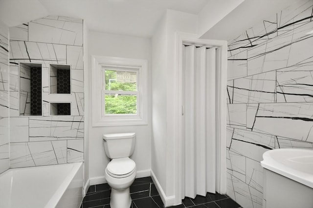 bathroom featuring toilet, tile patterned floors, and baseboards