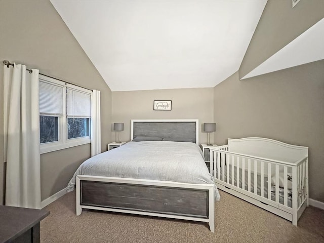 carpeted bedroom featuring vaulted ceiling